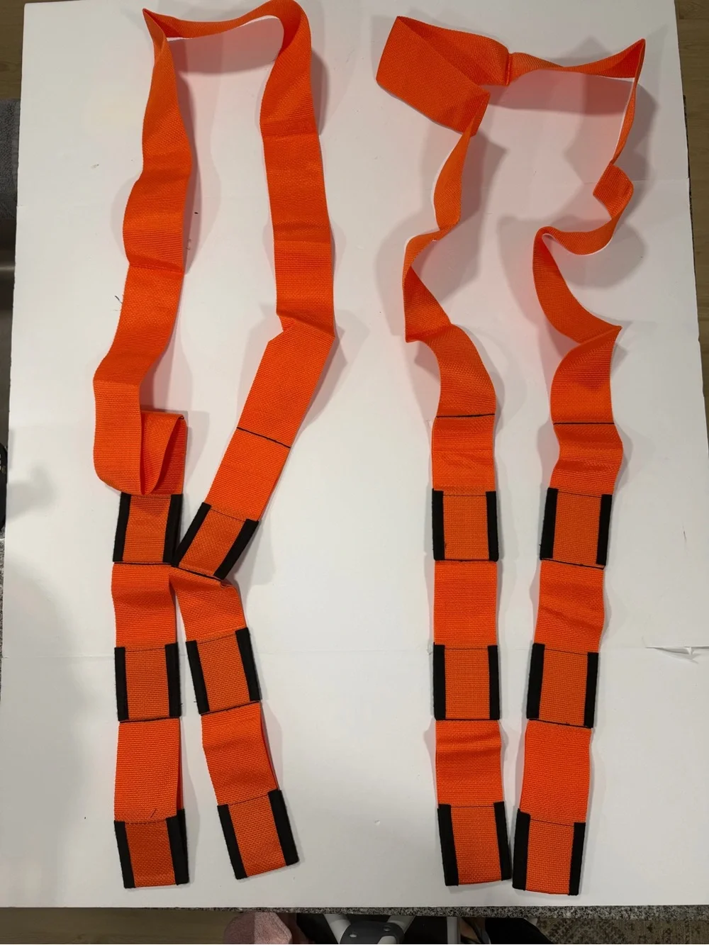 2 Orange and Black Forearm Forklift Moving Straps